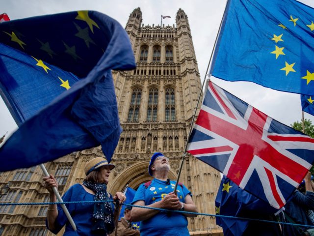 LONDON, ENGLAND - JUNE 12: Anti-Brexit demonstrators gather outside the Houses of Parliament on June 12, 2018 in London, England. The EU withdrawal bill returns to the House of Commons today for the first of two sessions in which MP's will consider amendments imposed by the Lords, and another set …