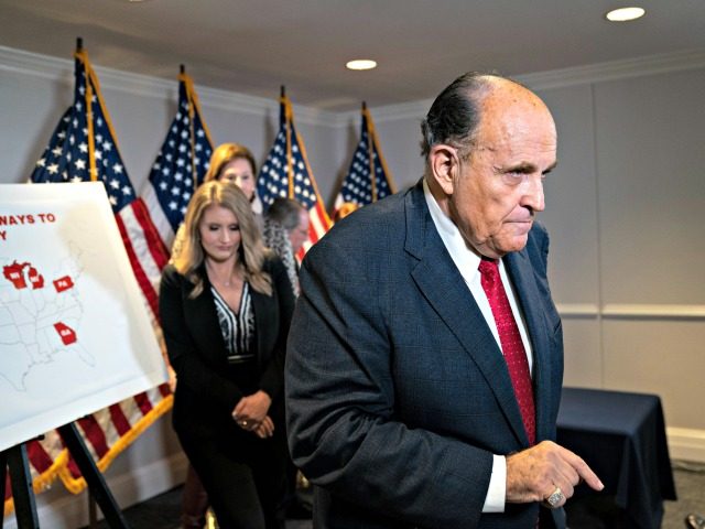 WASHINGTON, DC - NOVEMBER 19: Rudy Giuliani exits after speaking to the press about various lawsuits related to the 2020 election, inside the Republican National Committee headquarters on November 19, 2020 in Washington, DC. President Donald Trump, who has not been seen publicly in several days, continues to push baseless …