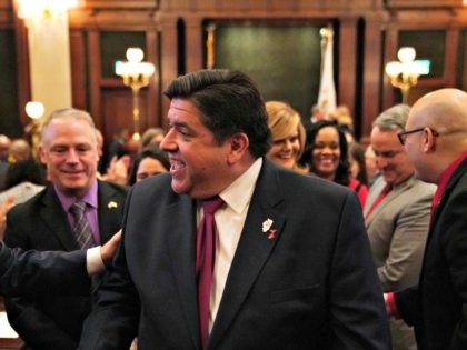 SPRINGFIELD, IL - FEBRUARY 20: Illinois Gov. J.B. Pritzker is congratulated by lawmakers a