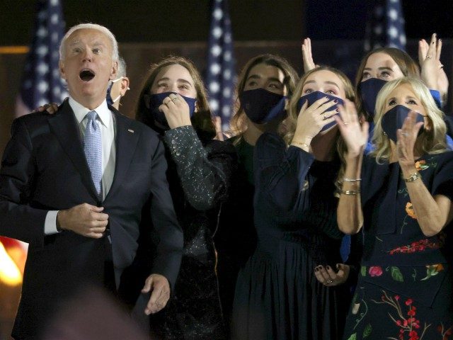 WILMINGTON, DELAWARE - NOVEMBER 07: President-elect Joe Biden and family watch fireworks from stage after Biden's address to the nation from the Chase Center November 07, 2020 in Wilmington, Delaware. After four days of counting the high volume of mail-in ballots in key battleground states due to the coronavirus pandemic, …