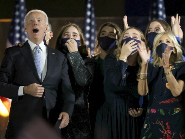 WILMINGTON, DELAWARE - NOVEMBER 07: President-elect Joe Biden and family watch fireworks from stage after Biden's address to the nation from the Chase Center November 07, 2020 in Wilmington, Delaware. After four days of counting the high volume of mail-in ballots in key battleground states due to the coronavirus pandemic, the race was called for Biden after a contentious election battle against incumbent Republican President Donald Trump. (Photo by Win McNamee/Getty Images)