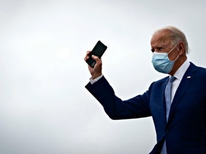 ATLANTA, GA - OCTOBER 27: Democratic presidential nominee Joe Biden holds his phone as he arrives at Atlanta International Airport on October 27, 2020 in Atlanta, Georgia. Biden is campaigning in Georgia on Tuesday, with scheduled stops in Atlanta and Warm Springs. (Photo by Drew Angerer/Getty Images)