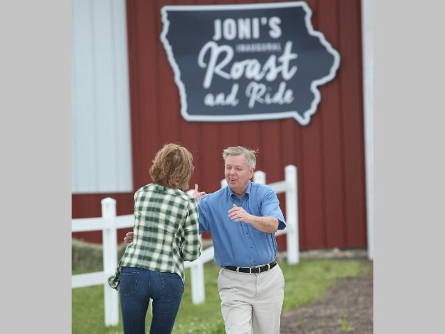 BOONE, IA - JUNE 06: Republican presidential hopeful former business executive Carly Fiorina (L) greets fellow 2016 presidential hopeful Senator Lindsey Graham (R-SC) at a Roast and Ride event hosted by freshman Senator Joni Ernst (R-IA) on June 6, 2015 in Boone, Iowa. Ernst is hoping the event, which featured …