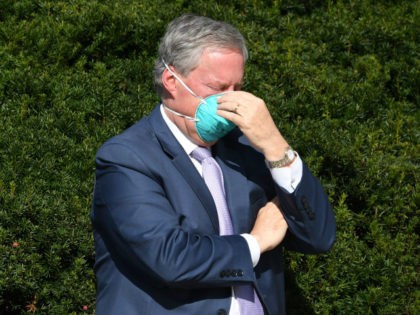 White House Chief of Staff Mark Meadows adjusts his mask as doctors update the press on th