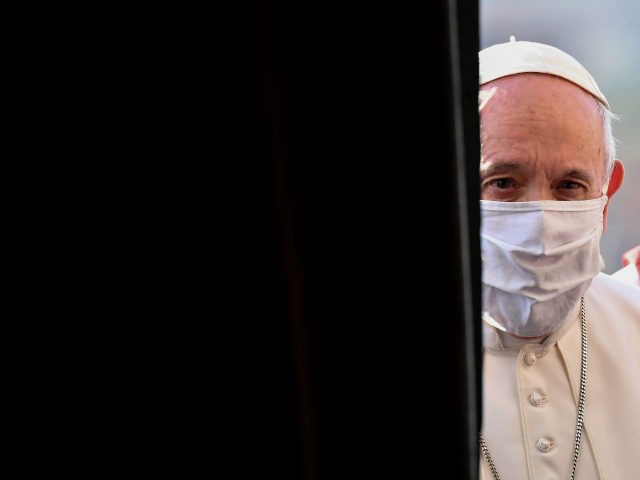 Pope Francis, wearing a protective face mask, arrives for an inter-religious prayer servic