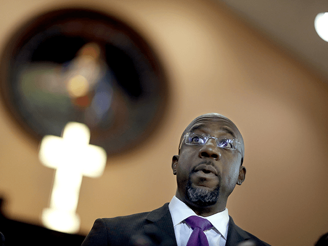 In this Jan. 12, 2018 file photo Rev. Raphael Warnock speaks at Ebenezer Baptist Church in