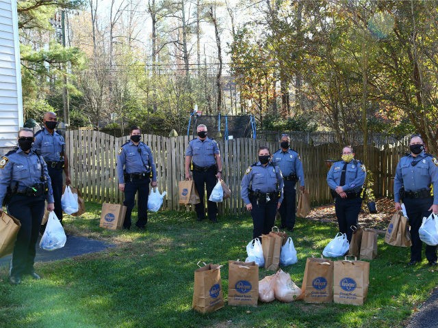Police officers in Henrico County, Virginia, recently helped anonymous donors distribute Thanksgiving meals to nearly 30 families in the area.