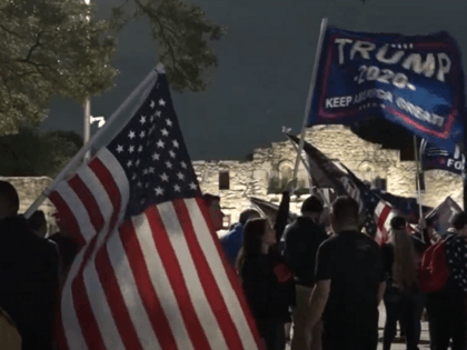 Trump supporters gather outside the Alamo on November 27 in defiance of a COVID-19 curfew imposed by the mayor of San Antonio. (Video Screenshot/SBG San Antonio)