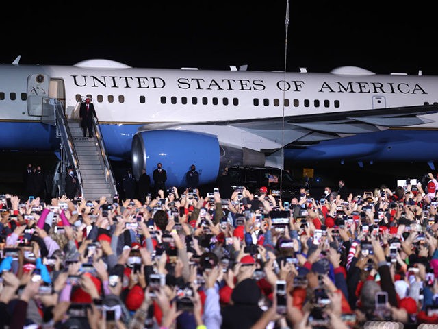 ROME, GEORGIA - NOVEMBER 01: U.S. President Donald Trump greets supporters as he walks off of Air Force One during a campaign rally at Richard B. Russell Airport on November 01, 2020 in Rome, Georgia. With two days to go until election day, Donald Trump is campaigning in Michigan, Iowa, …