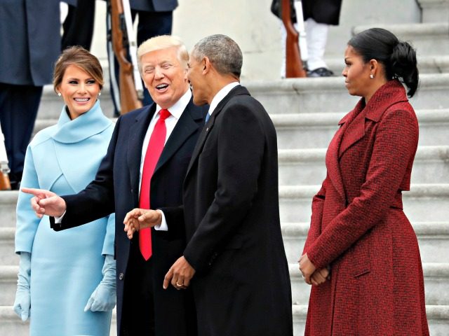 First lady Melania Trump stands as President Donald Trump and former President Barack Obama talk, with former first lady Michelle Obama, as they pause on the steps of the East Front of the U.S. Capitol as the Obamas depart, Friday, Jan. 20, 2017 in Washington. (AP Photo/Alex Brandon)