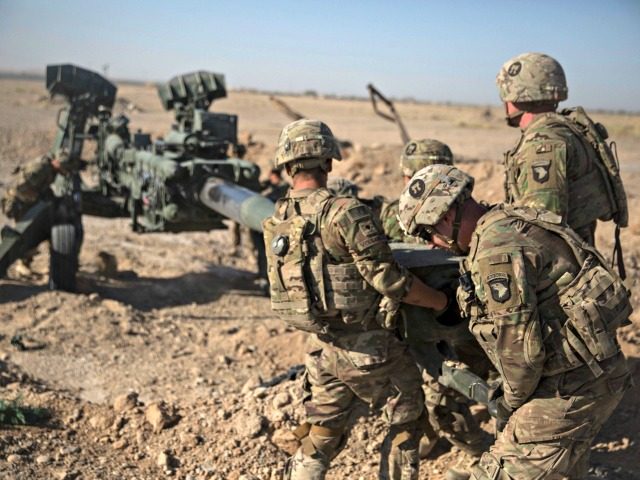 In this June 10, 2017 photo provided by Operation Resolute Support, U.S. Soldiers with Task Force Iron maneuver an M-777 howitzer, so it can be towed into position at Bost Airfield, Afghanistan. Reversing his past calls for a speedy exit, U.S. President Donald Trump recommitted the United States to the …