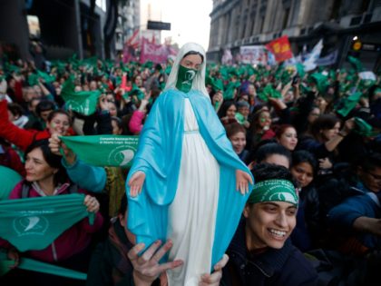 Activists with green handkerchiefs, which symbolizes the abortion rights movement, demonstrate to mark the revival of their campaign to legalize abortion, in front of the National Congress in Buenos Aires, on May 28, 2019. - Activists and lawmakers in Argentina relaunched a bid to legalize abortion on Tuesday with a &hellip;