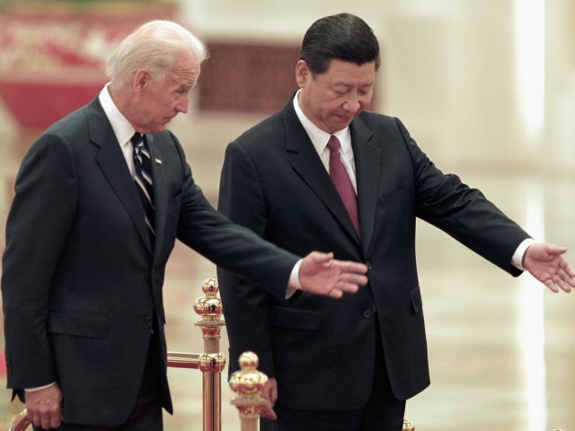 BEIJING, CHINA - AUGUST 18: Chinese Vice President Xi Jinping invites U.S. Vice President Joe Biden (L) to view an honour guard during a welcoming ceremony inside the Great Hall of the People on August 18, 2011 in Beijing, China. Biden will visit China, Mongolia and Japan from August 17-25. …