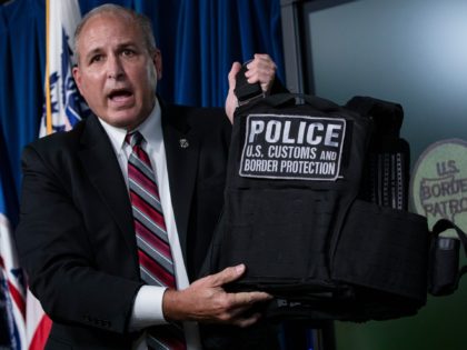WASHINGTON, DC - JULY 21: US Customs and Border Protection Commissioner Mark Morgan holds up a protective vest worn by Customs and Border Protection and Homeland Security agents in Portland during continued protests at the US Customs and Border Patrol headquarters on July 21, 2020 in Washington, DC. (Photo by …