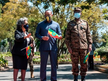 Sahle-Work Zewde (Center L), President of Ethiopia, stands next to Abiy Ahmed (Center R), Prime Minister of Ethiopia, and General Birhanu Jula (R), Chief of General Staff, stand during an event to honour the national defence forces in Addis Ababa, on November 17, 2020. - The United Nations on November …