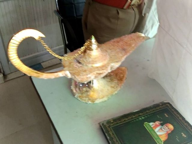 Police in India arrested two men on Sunday for allegedly scamming a doctor into paying seven million rupees – well over $90,000 – for a fake “Aladdin’s lamp,” complete with a fake genie.