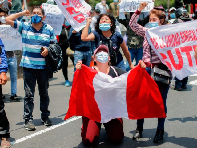 People celebrate outside the Congress in Lima after Peruvian interim president Manuel Meri