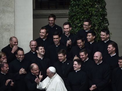TOPSHOT - Pope Francis jokes with priests at the end of a limited public audience at the San Damaso courtyard in The Vatican on September 30, 2020 during the COVID-19 infection, caused by the novel coronavirus. (Photo by Filippo MONTEFORTE / AFP) (Photo by FILIPPO MONTEFORTE/AFP via Getty Images)