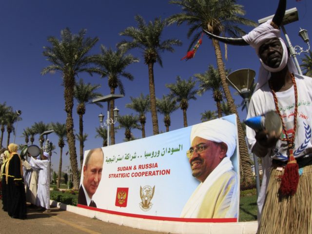 A portrait showing Sudan's President Omar al-Bashir (R) and his Russian counterpart Valdimir Putin is pictured during a welcoming ceremony for Russian Foreign Minister Sergei Lavrov in Khartoum on December 3, 2014. Lavrov held talks with his Sudanese counterpart Ali Karti before attending the Russian-Arab forum on a one-day visit …