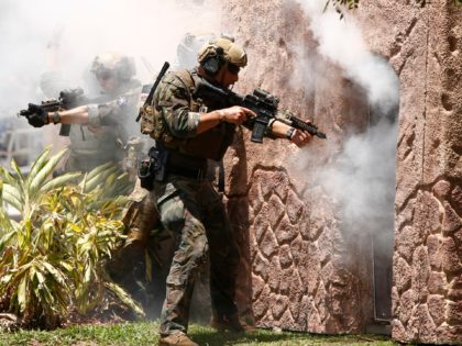 TAMPA, FL - MAY 23: Special operators assault a simulated terrorist building to search for Tampa mayor Bob Buckhorn, playing the roll of a dignitary kidnapped by terrorists, while participating in an International Special Operations Forces capabilities exercise, featuring operators from nine different countries, during the Special Operations Forces Industry …