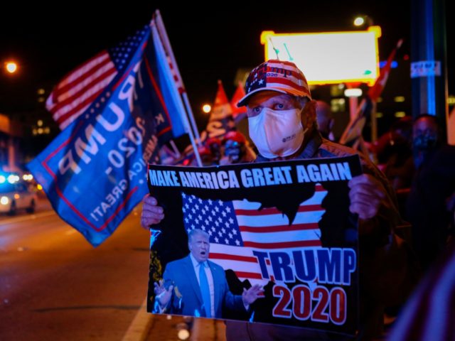 TOPSHOT - Supporters of US President Donald Trump rally in front of cuban restaurant Versailles in Miami, Florida on November 3, 2020. (Photo by Eva Marie UZCATEGUI / AFP) (Photo by EVA MARIE UZCATEGUI/AFP via Getty Images)