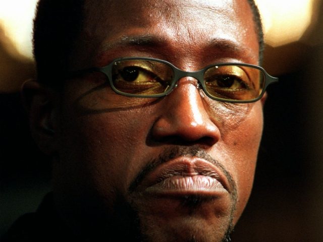 Actor Wesley Snipes pauses to consider a reporter's question at the premiere of New L