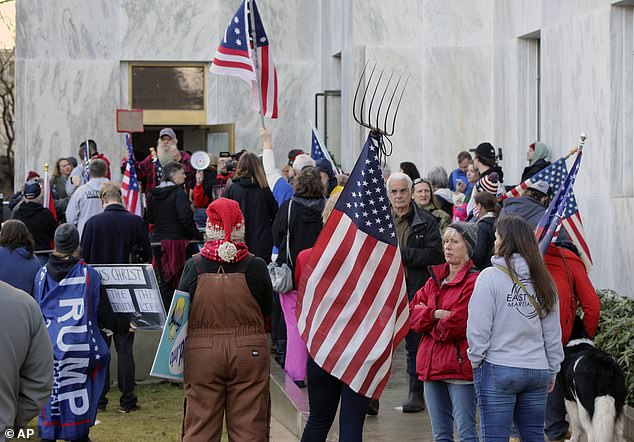 Protesters gather outside Oregon Capitol on December 21 to protest government-imposed lockdown. (AP Photo)