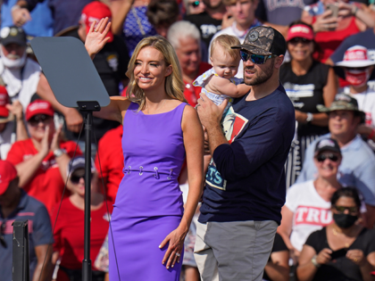 White House press secretary Kayleigh McEnany waves to the crowd as she stands on stage with her husband Sean Gilmartin and daughter Blake during a rally by President Donald Trump Thursday, Oct. 29, 2020, in Tampa, Fla. Gilmartin is a pitcher for the Tampa Bay Rays baseball team. (AP Photo/Chris …