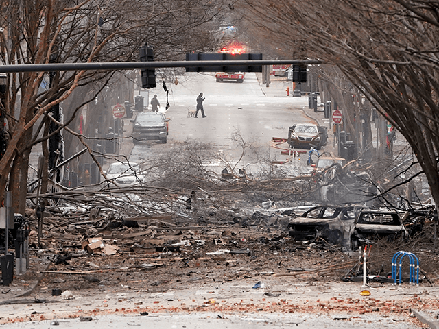 Emergency personnel work near the scene of an explosion in downtown Nashville, Tenn., Frid