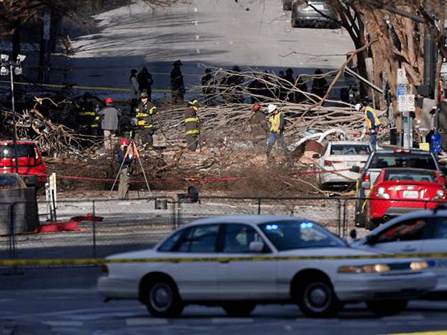Investigators continue to examine the site of an explosion Sunday, Dec. 27, 2020, in downt