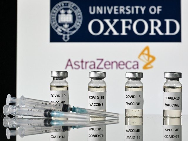 An illustration picture shows vials with Covid-19 Vaccine stickers attached and syringes, with the logo of the University of Oxford and its partner British pharmaceutical company AstraZeneca, on November 17, 2020. (Photo by JUSTIN TALLIS / AFP) (Photo by JUSTIN TALLIS/AFP via Getty Images)