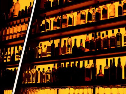 Rows of bottles sitting on shelf in a bar, trademarks deleted, bottle design altered