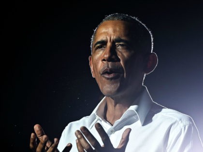Former US President Barack Obama speaks at a drive-in rally as he campaigns for Democratic