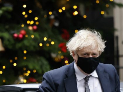 Britain's Prime Minister Boris Johnson returns to 10 Downing Street in central London on December 16, 2020, after taking part in the weekly session of Prime Minister Question (PMQs) at the House of Commons. (Photo by Tolga Akmen / AFP) (Photo by TOLGA AKMEN/AFP via Getty Images)