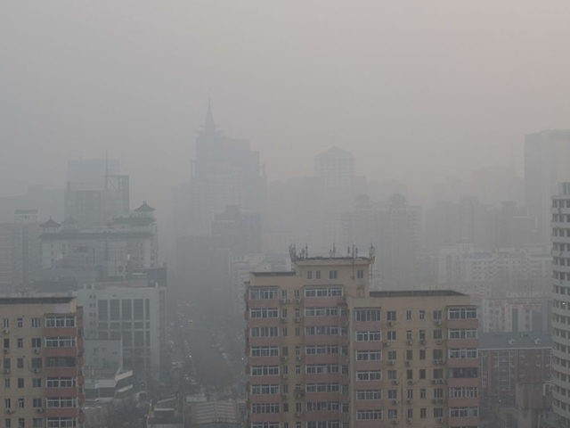 Buildings are seen on a polluted day in Beijing on January 18, 2020. (Photo by NICOLAS ASFOURI / AFP) (Photo by NICOLAS ASFOURI/AFP via Getty Images)
