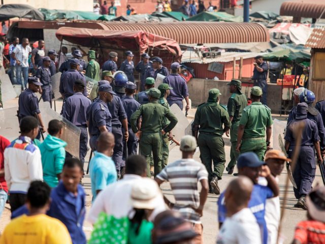 Protesters face off with eSwatini anti-riot police following scuffles on September 19, 201