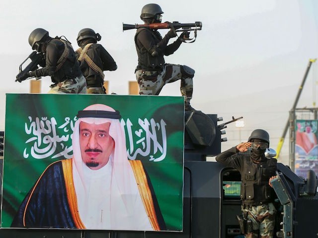 Saudi armed forces take part in a parade in Saudi Arabia's holy city of Mecca during a military drill on August 13, 2018, behind a portrait of the Saudi King Salman, ahead of the annual Hajj pilgrimage, - The hajj to Mecca, the most revered site in Islam, is a …
