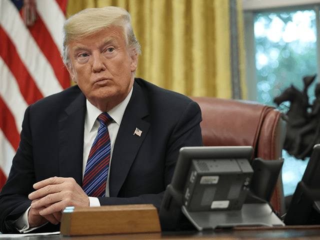 U.S. President Donald Trump speaks on the telephone via speakerphone with Mexican President Enrique Pena Nieto in the Oval Office of the White House on August 27, 2018 in Washington, DC. Trump announced that the United States and Mexico have reached a preliminary agreement on trade. (Photo by Win McNamee/Getty …