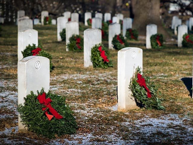 Wreaths placed on graves at a national cemetery in Virginia.