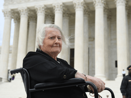 Transgender activist Aimee Stephens, sits in her wheelchair outside the US Supreme Court in Washington, DC, October 8, 2019, as the Court holds oral arguments in three cases dealing with workplace discrimination based on sexual orientation. - Thomas Rost, owner of RG & GR Harris Funeral Homes in Garden City, …