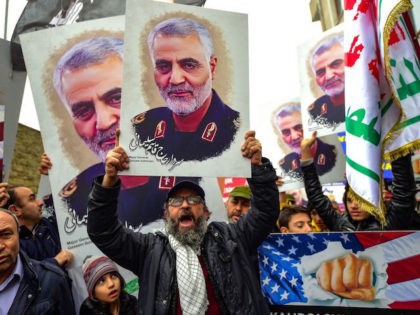 TOPSHOT - Protesters hold pictures of Iranian commander Qasem Soleimani, during a demonstration outside the US consulate in Istanbul, on January 5, 2020, two days after top Iranian commander Qasem Soleimani was killed by a US drone strike. - A US drone strike killed top Iranian commander Qasem Soleimani at …
