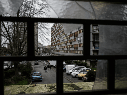 A man walks in a street of the social housing complex of the Chêne-Pointu, in Clichy-sous-Bois, in the suburbs of the French capital Paris on February 4, 2020. - Most of the residents of the 'Chêne-Pointu' housing estate did not see the film that was shot in front of their …