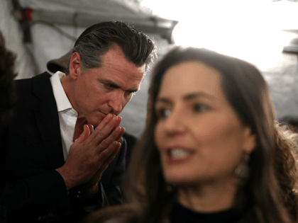 California Gov. Gavin Newsom (L) and Oakland Mayor Libby Schaaf (R) talk with reporters after a news conference about the state's efforts on the homelessness crisis on January 16, 2020 in Oakland, California. Newsom was joined by Schaaf to announce that Oakland will receive 15 unused FEMA trailers for the …