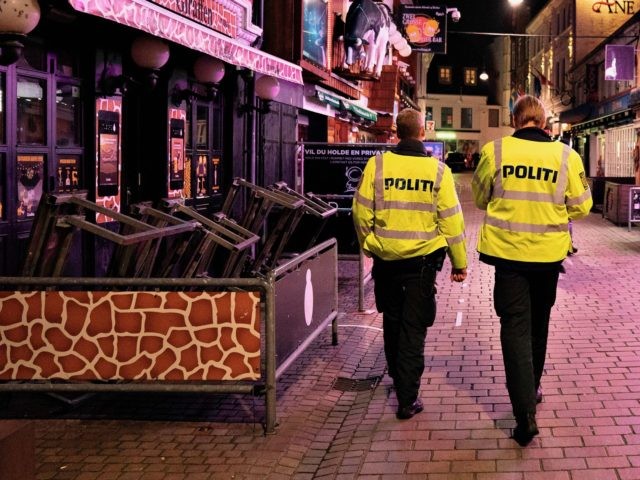 Police patrol the well-known amusement street Jomfru Ane Gade in Aalborg, Denmark, after 2