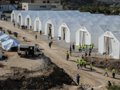 A picture taken on October 14, 2020 shows the Kara Tepe camp for refugees and migrants on the island of Lesbos. - Greece will build a new permanent camp on the island of Lesbos next year to replace the facility that burned down last month, the migration minister said October …