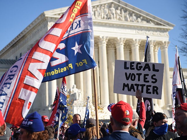 Supporters of US President Donald Trump rally at the US Supreme Court in Washington, DC, on November 14, 2020. - Supporters are backing Trump's claim that the November 3 election was fraudulent. (Photo by Olivier DOULIERY / AFP) (Photo by OLIVIER DOULIERY/AFP via Getty Images)