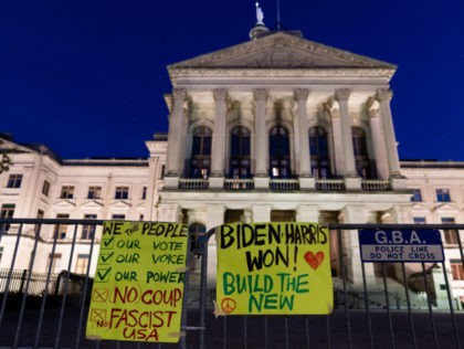 ATLANTA, GA - NOVEMBER 14: Signs supporting President-elect Joe Biden are seen on a fence outside the Georgia State Capitol on November 14, 2020 in Atlanta, Georgia. President-elect Joe Biden has been declared the winner in Georgia, becoming the first Democratic nominee to win the state since 1992. (Photo by …