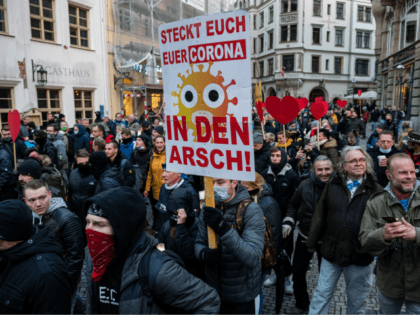 LEIPZIG, GERMANY - NOVEMBER 21: People gather to protest against coronavirus lockdown measures during the second wave of the pandemic on November 21, 2020 in Leipzig, Germany. The demonstration, which includes a range of protesters including neo-Nazis, hooligans, conspiracy theory activists and ordinary citizens, comes on the heels of a …