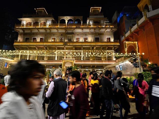 Hindu devotees celebrate Dev Deepawali, in Varanasi on November 30, 2020. (Photo by SANJAY