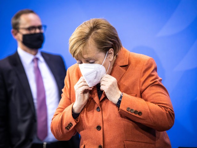 BERLIN, GERMANY - DECEMBER 13: German Chancellor Angela Merkel wears a face mask at the press briefing to the media about new, stricter lockdown measures following a meeting of federal and states government leaders on December 13, 2020 in Berlin, Germany. Germany has seen record numbers of daily new infections …